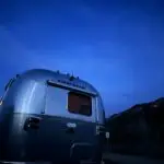 Rear of Airstream set against cobalt blue sky shortly after sunset