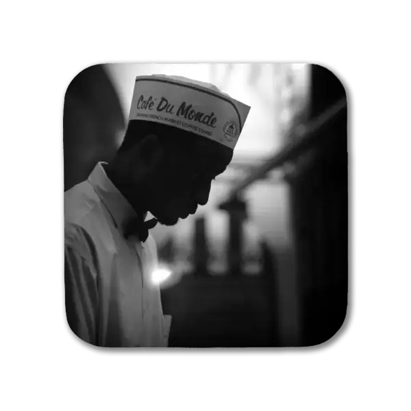 Coaster with a B&W Image in New Orleans' French Quarter of a Cafe du Monde worker in silhouette