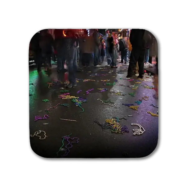 Coaster depicting New Orleans' French Quarter, color with beads on Bourbon Street