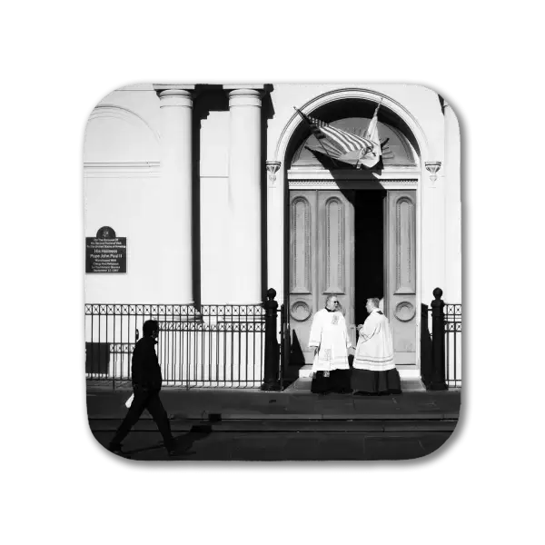 Coaster featuring a B&W image of two priests conversing outside St Louis Cathedral