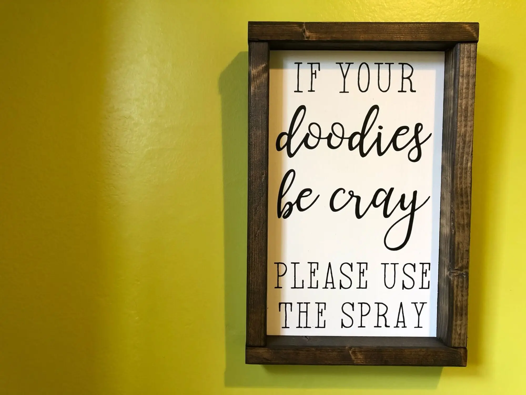 Restroom sign: If your doodies be cray, please use the spray