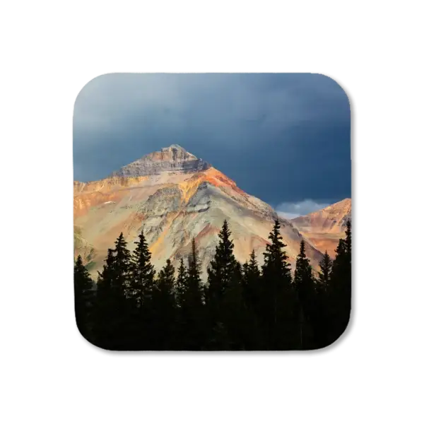 A colorful Colorado mountain shows off its sheets of orange, red, and yellow ore, artwork for a coaster