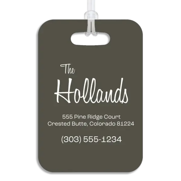 Colored reverse side of a premium luggage tag, showing the owner's name in a mid-century modern script font, plus their address and contact information in a wide, modern font.