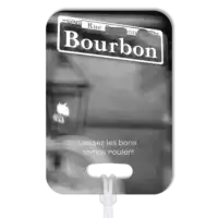 Premium luggage tag featuring Bourbon Street sign in New Orleans in B&W. Superimposed text says in French, Laissez les bone temps rouler!