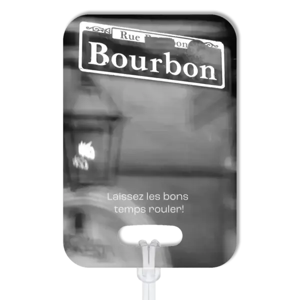 Premium luggage tag featuring Bourbon Street sign in New Orleans in B&W. Superimposed text says in French, Laissez les bone temps rouler!