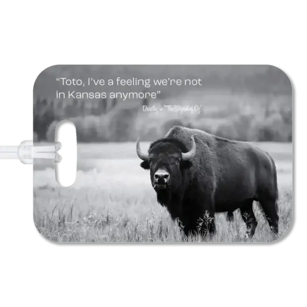 Grand Teton Buffalo Luggage Tag Premium luggage tag featuring a bison in a field with mountains in the background. Superimposed text says "Toto, I've a feeling we're not in Kansas anymore" by Dorothy in The Wizard of Oz