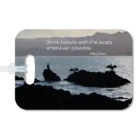 New Zealand luggage tag Premium luggage tag featuring New Zealand sea birds sunning themselves on coastal rocks on a bay. Superimposed quote says Drink heavily with the locals whenever possible, by Anthony Bourdain