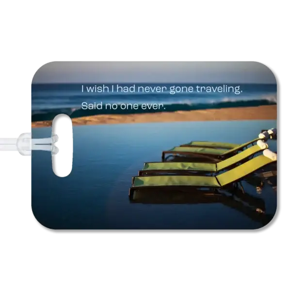 Lounge Chairs Luggage Tag Premium luggage tag featuring a Mexican resort with lounge chairs at the edge of an infinity pool with the beach and ocean in the background. Superimposed text says, "I wish I had never gone traveling. Said no one ever."