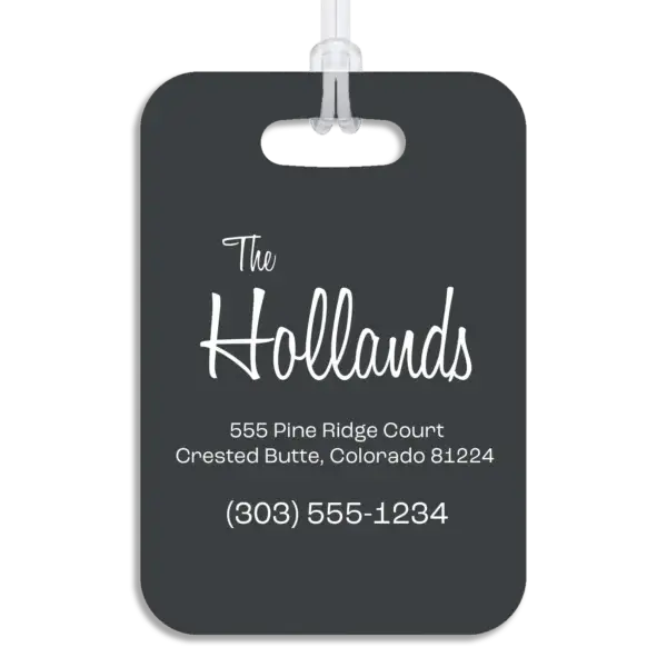 Colored reverse side of a premium luggage tag, showing the owner's name in a mid-century modern script font, plus their address and contact information in a wide, modern font.