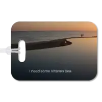 Infinity Pool at Sunrise Luggage Tag Premium luggage tag featuring a couple walking along a beach at a Mexican resort. Superimposed text says, I need some Vitamin Sea.