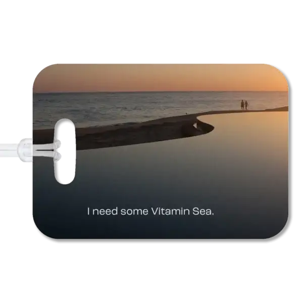 Infinity Pool at Sunrise Luggage Tag Premium luggage tag featuring a couple walking along a beach at a Mexican resort. Superimposed text says, I need some Vitamin Sea.