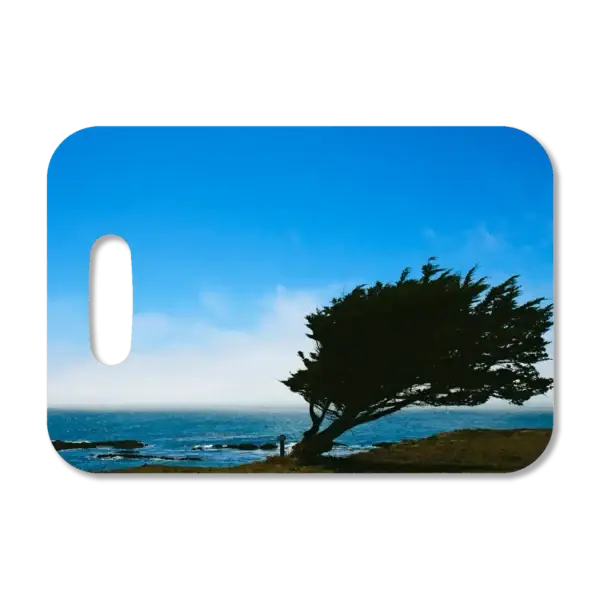 Premium luggage tag featuring a windblown tree in Sea Ranch along a Northern California coastline