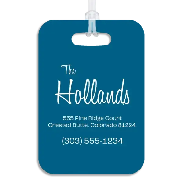 Colored reverse side of a premium luggage tag, showing the owner's name in a mid-century modern script font, plus their address and contact information in a wide, modern font.