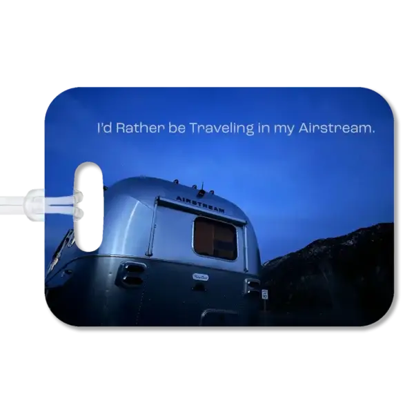I'd Rather by Traveling in my Airstream Luggage Tag Premium luggage tag featuring an Airstream trailer just after sunset