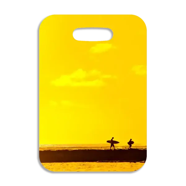 Premium luggage tag featuring two surfers walking along a Hawaiian beach jetty.