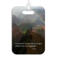Kauai Luggage Tag Premium luggage tag featuring a Kauai mountainous coastline with a colorful rainbow. Superimposed text says I've been to almost as many places as my luggage, by Bob Hope.