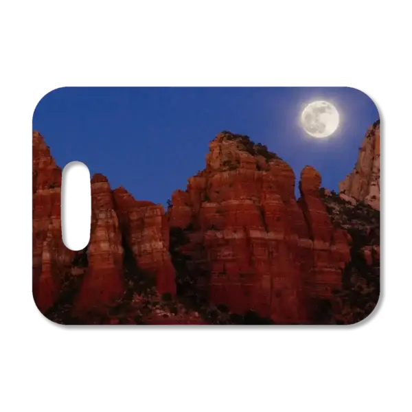 Premium luggage tag featuring Sedona red rocks and the full moon rising above, shortly after sunset.