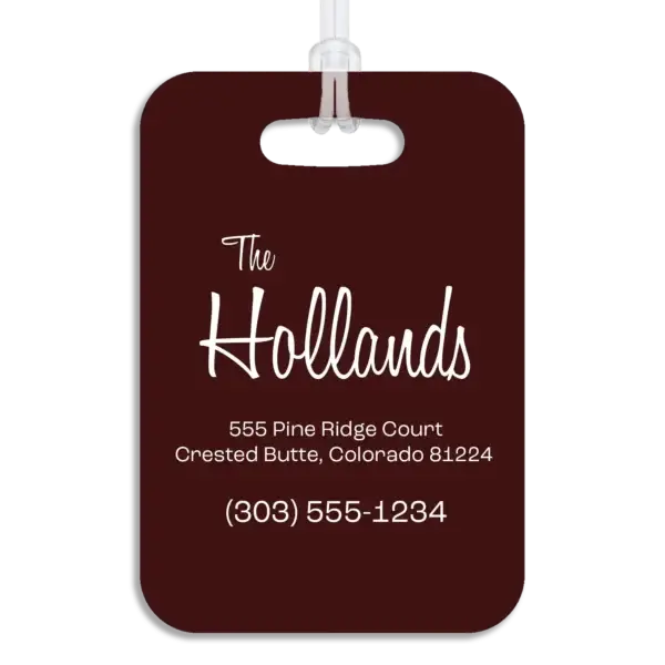 Colored reverse side of a premium luggage tag, showing the owner's name in a mid-century modern script font, plus their address and contact information in a wide, modern font.